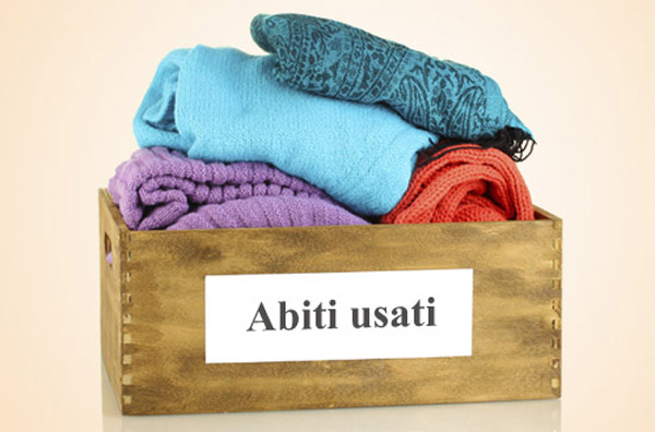 Donation box with clothing isolated on white